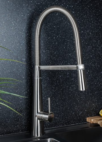 The new and  modern steel faucet in the kitchen
