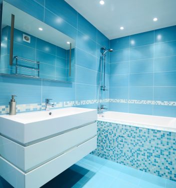 Modern luxury bathroom blue interior. No brandnames or copyright objects.
